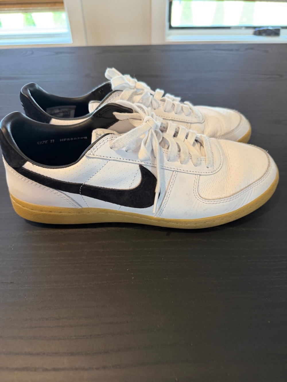 Nike Men’s White Leather Sneakers with Black Swoosh and Gum Sole